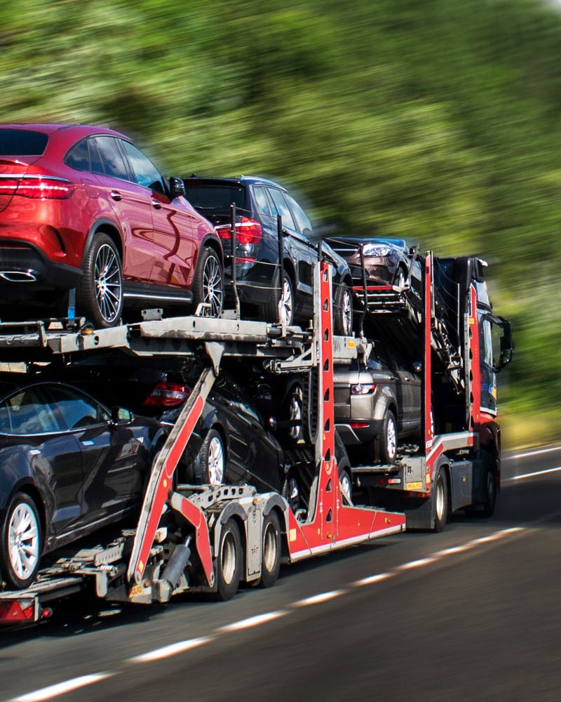 truck loaded with a range of vehicles ready for car shipping